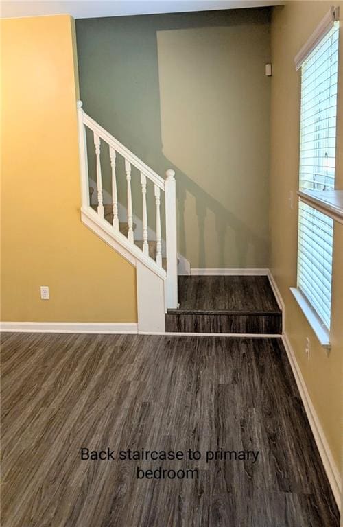 stairs featuring hardwood / wood-style flooring