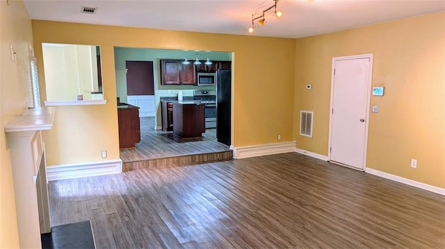 unfurnished living room featuring dark hardwood / wood-style floors