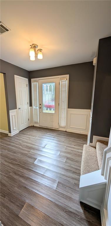 foyer entrance with light hardwood / wood-style flooring