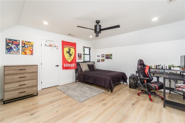 bedroom with visible vents, lofted ceiling, recessed lighting, wood finished floors, and a ceiling fan