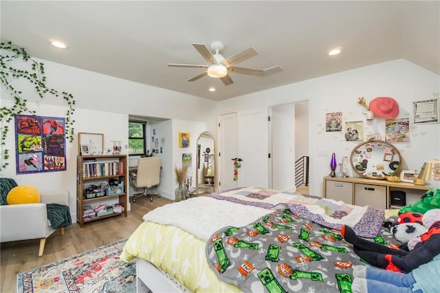 bedroom with recessed lighting, wood finished floors, a ceiling fan, and vaulted ceiling