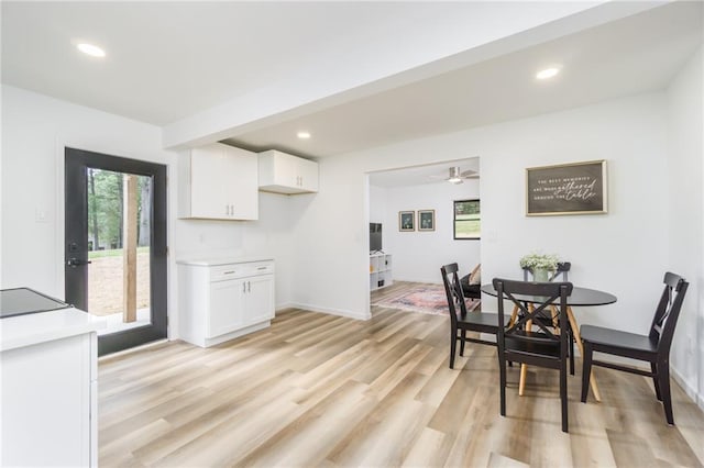 dining room featuring recessed lighting, baseboards, and light wood finished floors