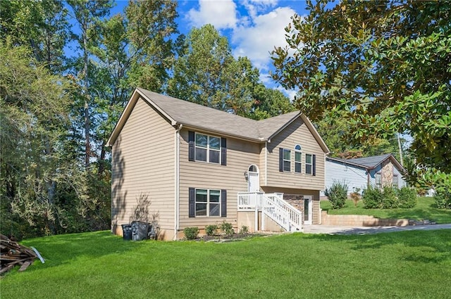 raised ranch featuring a front yard