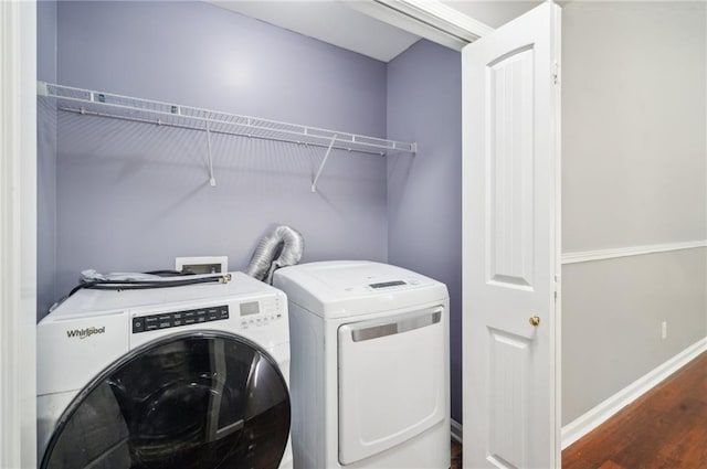 washroom featuring independent washer and dryer and dark hardwood / wood-style flooring