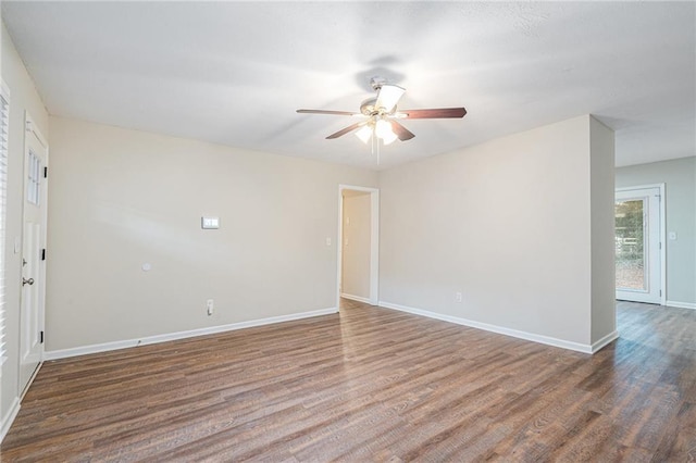 unfurnished room featuring ceiling fan and dark hardwood / wood-style floors