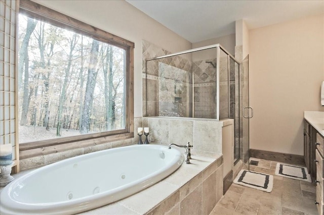 bathroom featuring vanity and separate shower and tub