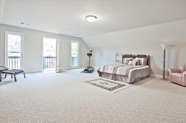 carpeted bedroom with vaulted ceiling