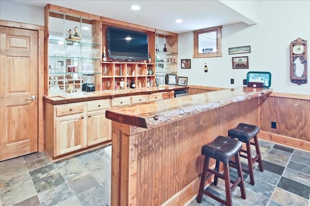 bar featuring butcher block counters