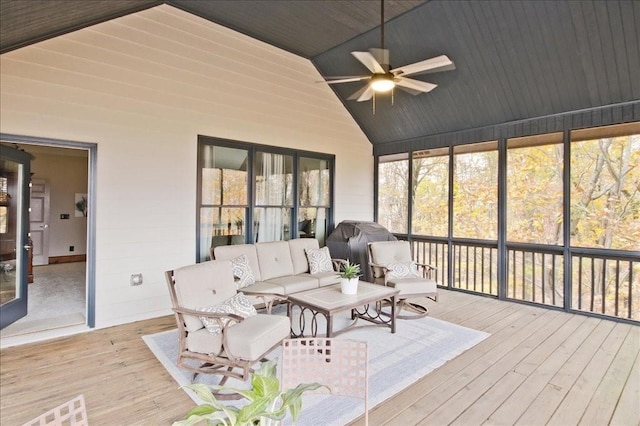 sunroom featuring wood ceiling, ceiling fan, and vaulted ceiling