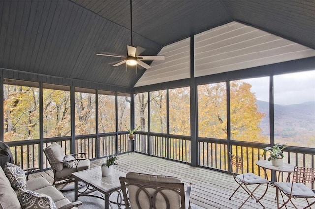 unfurnished sunroom featuring vaulted ceiling and ceiling fan