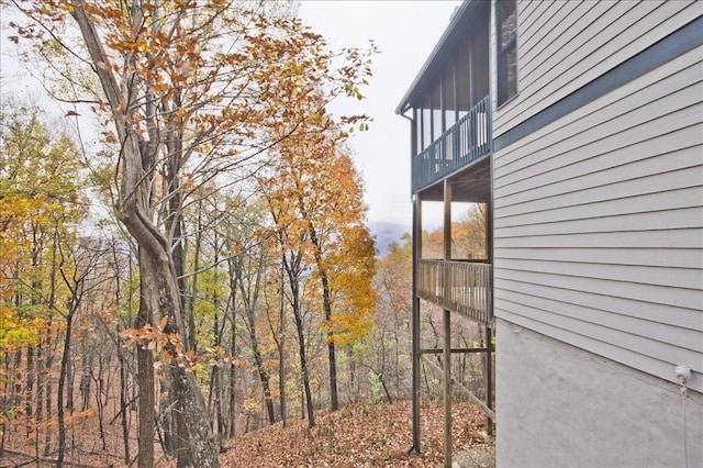 view of side of property with a balcony