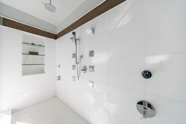 full bath featuring tiled shower