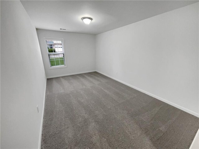 2231 Mill Garden Pl, Buford, GA 30519 - empty room with attic access, crown molding, and carpet