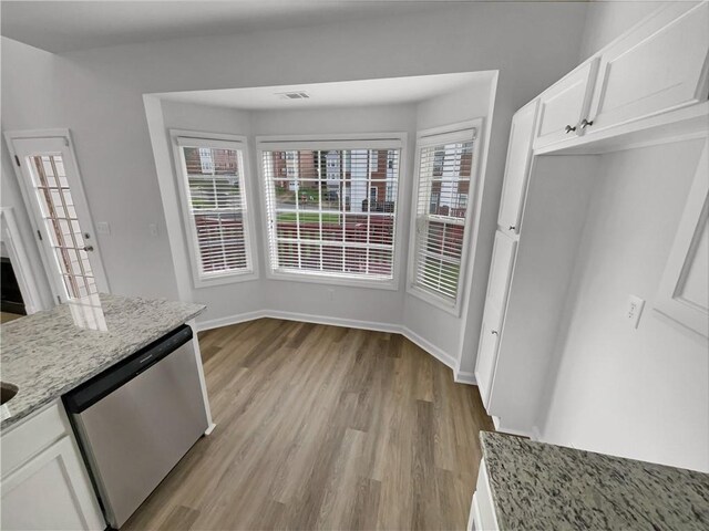 2231 Mill Garden Pl, Buford, GA 30519 - unfurnished living room featuring a ceiling fan, light carpet, a fireplace, a high ceiling, and stairway