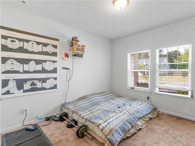 bedroom with light colored carpet