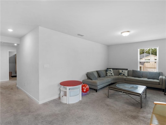 living room featuring light carpet