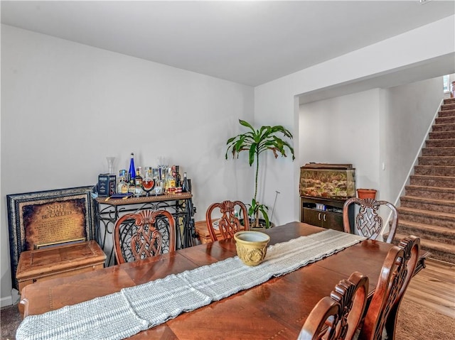 dining area with hardwood / wood-style flooring