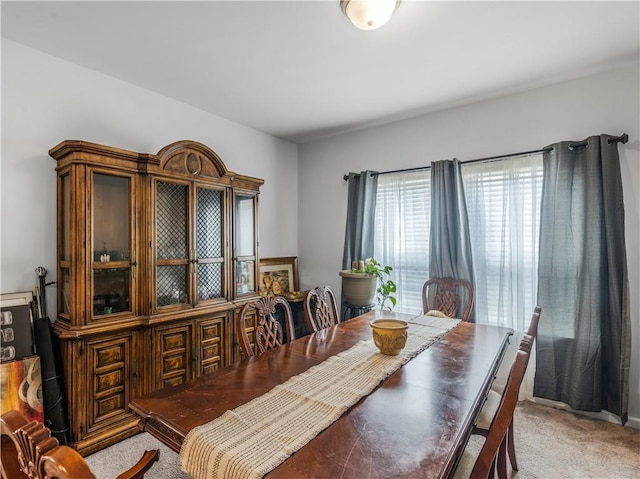 dining space with light colored carpet