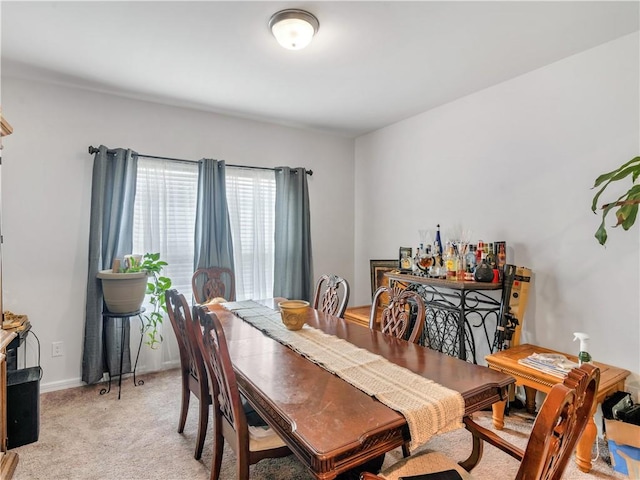 view of carpeted dining area