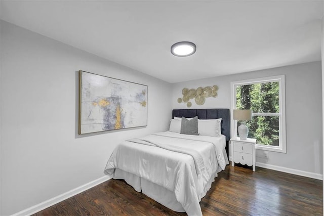 bedroom featuring dark wood-type flooring