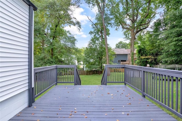 wooden terrace with fence and a yard