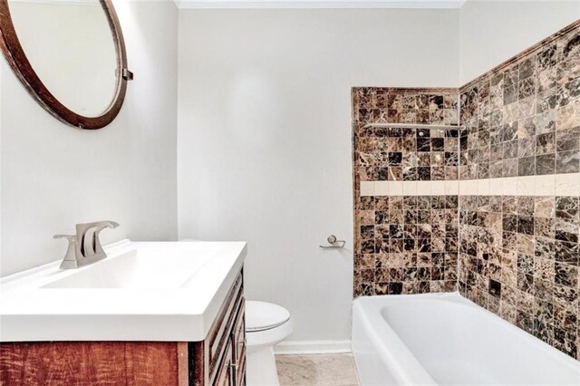 bathroom featuring vanity, baseboards, toilet, and shower / bathing tub combination