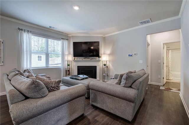 living room with crown molding, visible vents, and dark wood-style flooring