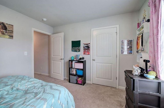 carpeted bedroom featuring baseboards