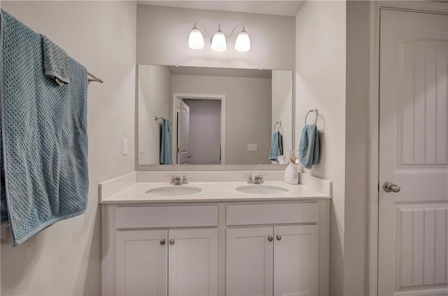 full bath featuring double vanity and a sink