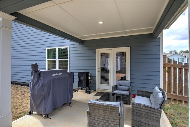 view of patio / terrace with fence, grilling area, and an outdoor hangout area