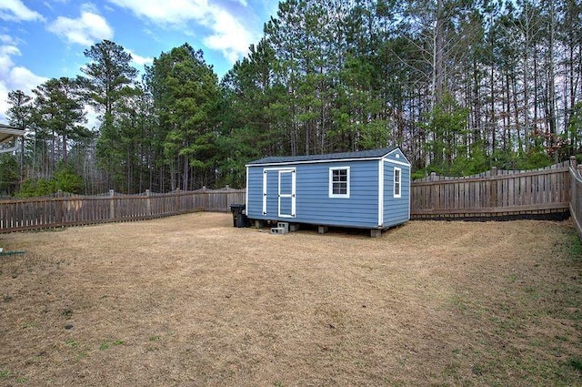 view of shed featuring a fenced backyard