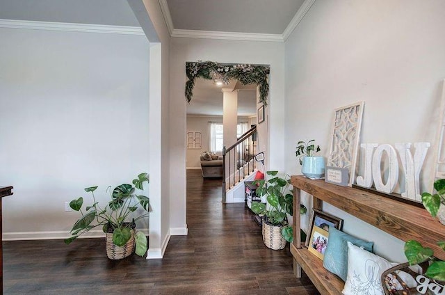 hallway with crown molding, stairway, baseboards, and wood finished floors