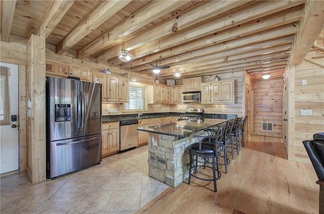 128 Rushing Waters Ct, Talking Rock, GA 30175 - kitchen with stainless steel appliances, a kitchen bar, a wooden ceiling with exposed beams, light brown cabinetry, and a kitchen island