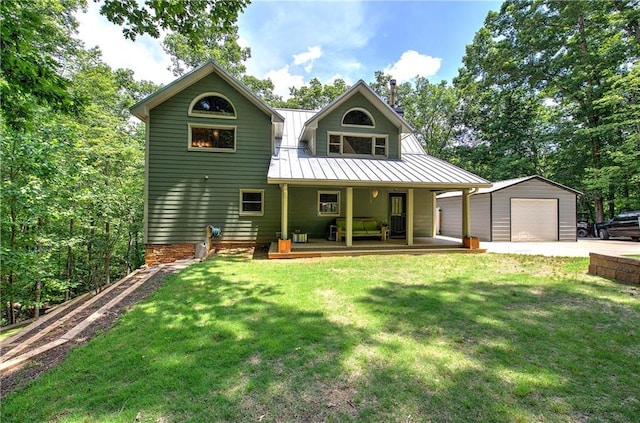 128 Rushing Waters Ct, Talking Rock, GA 30175 - rear view of house with a porch, an outdoor structure, a yard, and a metal roof