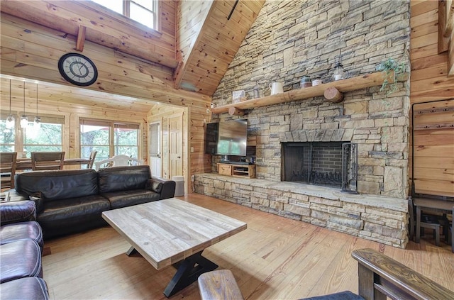 128 Rushing Waters Ct, Talking Rock, GA 30175 - living area featuring hardwood / wood-style flooring, high vaulted ceiling, a fireplace, and wooden walls
