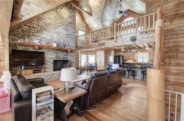128 Rushing Waters Ct, Talking Rock, GA 30175 - living room with healthy amount of natural light, a wooden ceiling with exposed beams, light wood-style flooring, a ceiling fan, and high vaulted ceiling