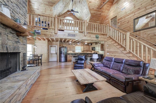 128 Rushing Waters Ct, Talking Rock, GA 30175 - living room featuring light wood-style flooring, high vaulted ceiling, a ceiling fan, stairway, and wood ceiling