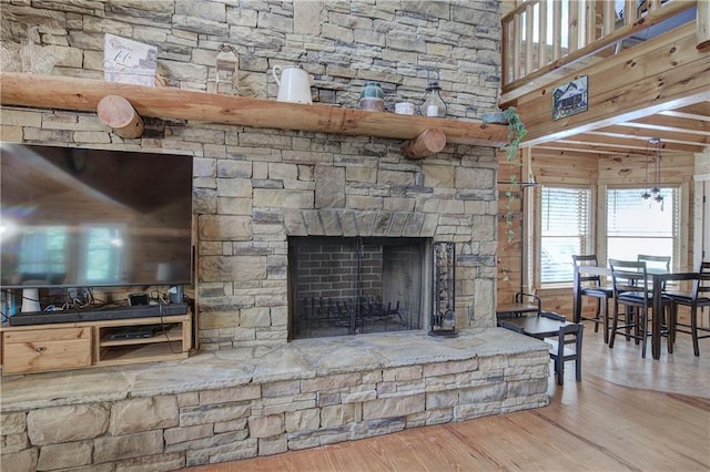 128 Rushing Waters Ct, Talking Rock, GA 30175 - detailed view of wood finished floors and a stone fireplace