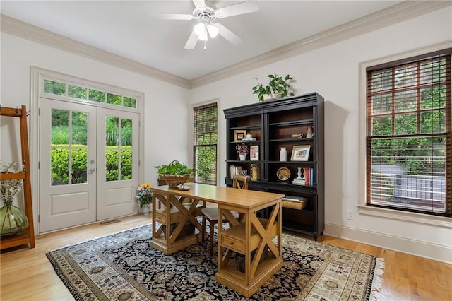 dining room with french doors, ornamental molding, a ceiling fan, light wood finished floors, and a desk