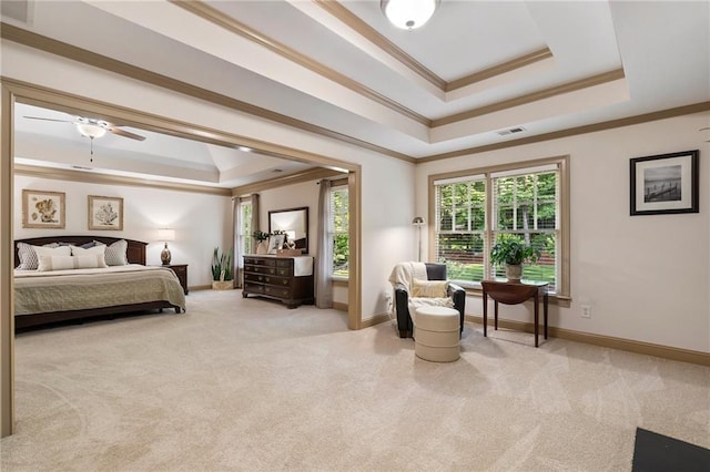 bedroom with a raised ceiling, ornamental molding, carpet floors, and baseboards