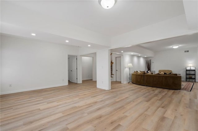 living area with light wood finished floors, recessed lighting, and baseboards