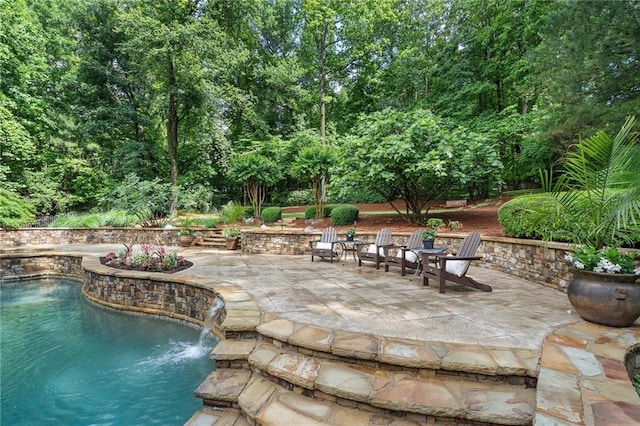 swimming pool featuring a patio area