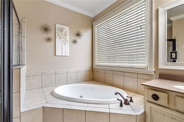 bathroom with vanity, crown molding, and a bath
