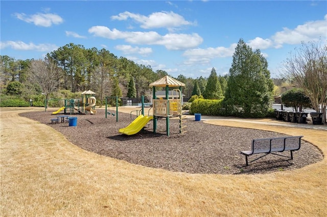 community jungle gym with a lawn