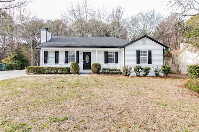 ranch-style home with a porch and a front yard