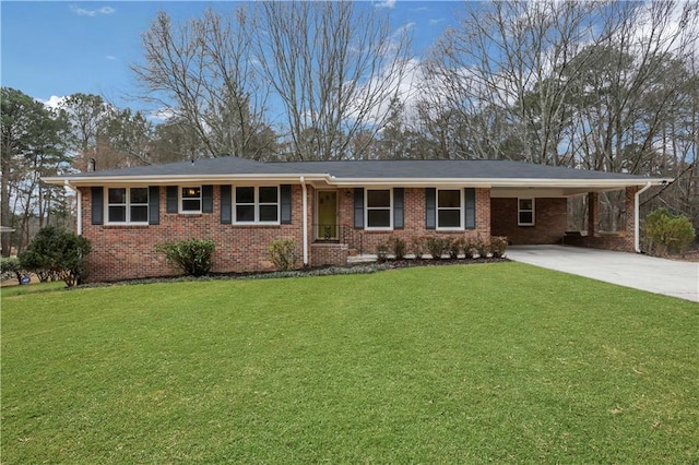 ranch-style house featuring a carport, concrete driveway, brick siding, and a front yard