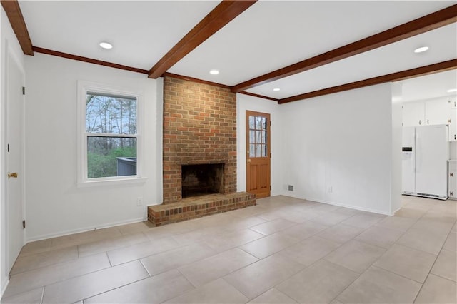 unfurnished living room featuring light tile patterned floors, a brick fireplace, beam ceiling, and baseboards