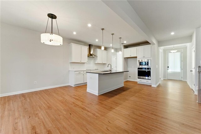 20 Running Ter NW, Cartersville, GA 30121 - kitchen featuring light wood-style flooring, appliances with stainless steel finishes, a sink, open floor plan, and wall chimney range hood
