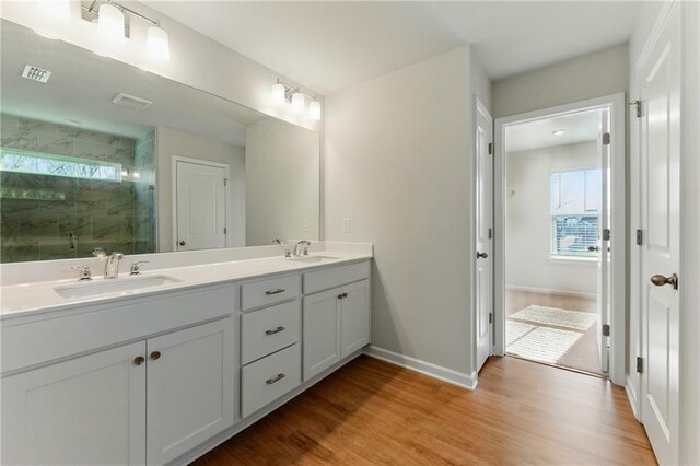 20 Running Ter NW, Cartersville, GA 30121 - bathroom featuring a marble finish shower, baseboards, a sink, and wood finished floors
