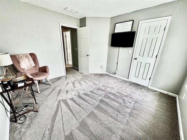 unfurnished room featuring light carpet